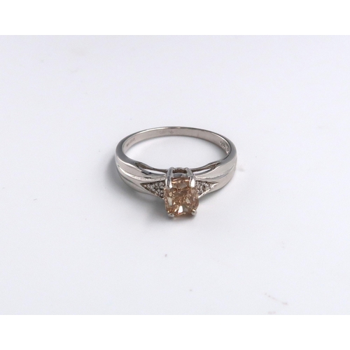 31 - An 18ct gold cushion cut 'champagne' diamond with a trefoil of 'white' brilliant cut diamonds to eac... 