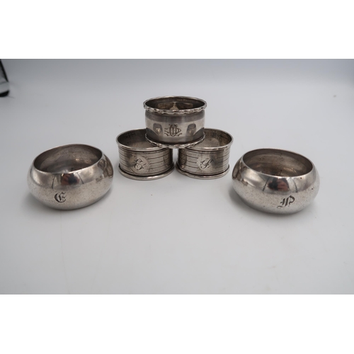 325 - Five silver hallmarked napkin rings, differing design and years - approx total weight 3.32 troy oz