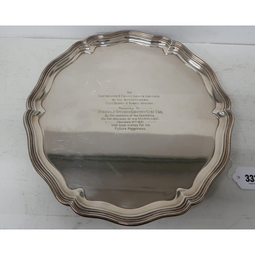 333 - A Silver H.M. Salver with pie crust boarder raised on three short hoof feet, bearing engraving acros... 