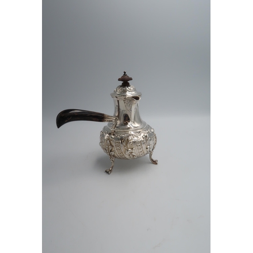 340 - A silver hallmarked Chocolate pot with ebonised handle, foliate embossed decoration London 1903, 11.... 