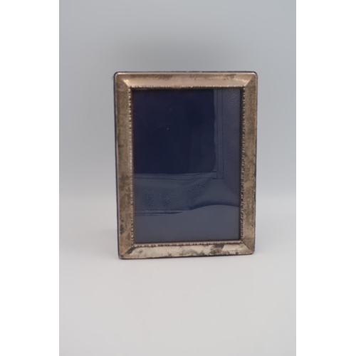 365 - A hallmarked silver photo frame - 21cm x 16cm