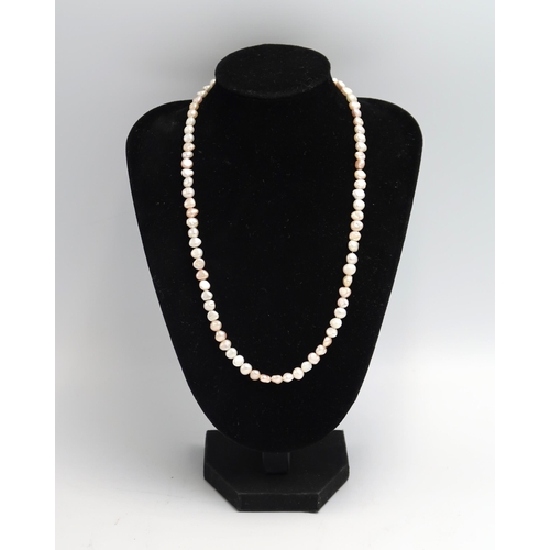 44 - A freshwater pearl necklace. Clasp stamped 9K. Weight 13.78 grams