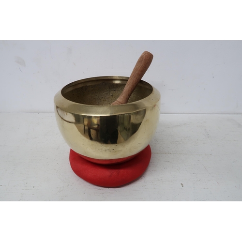 444 - A handmade Tibetan singing bowl set for meditation 10cm high 15cm diameter, in good condition