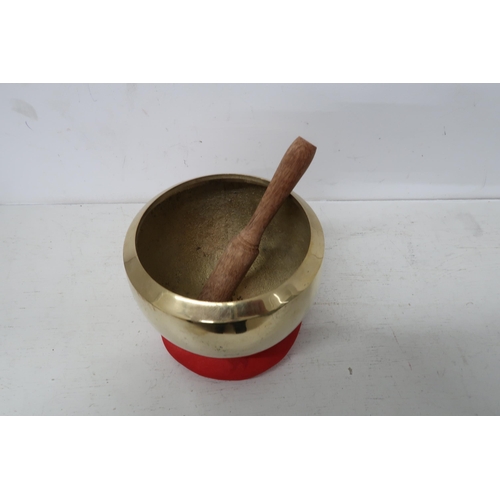 444 - A handmade Tibetan singing bowl set for meditation 10cm high 15cm diameter, in good condition