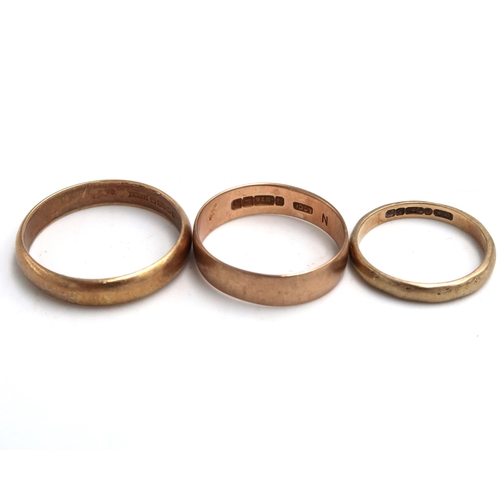 46 - Three 9ct marked wedding bands - ring sizes I/J, M and R/S - total weight approx 4.5 grams - all in ... 