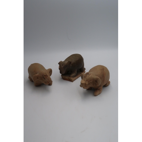 460 - Indo-Chinese antique terracotta figures of two elephants and a bison, all have loss and damage