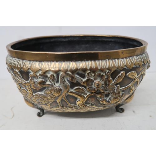 484 - A heavy brass bowl decorated with peacocks and other birds - 22cm x 16cm