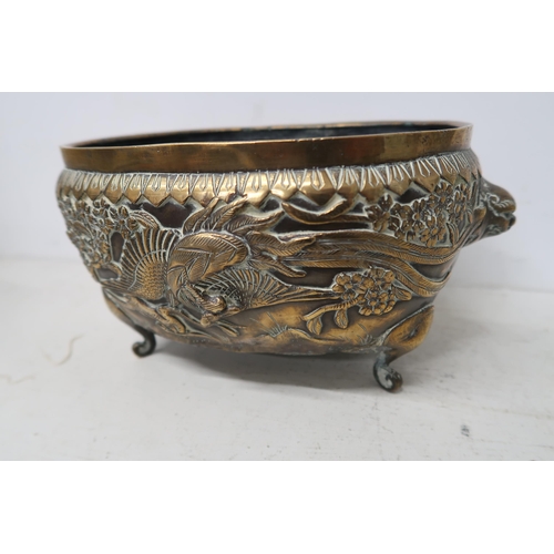 484 - A heavy brass bowl decorated with peacocks and other birds - 22cm x 16cm