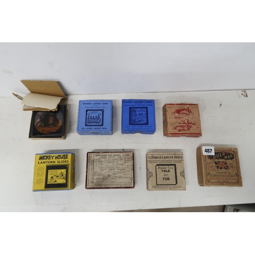 487 - Eight boxes of Magic Lantern slides including Mickey Mouse, The Boer War