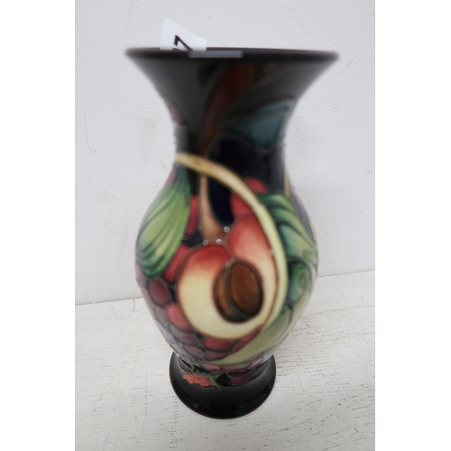 507 - A Moorcroft Queens Choice vase - Height 20cm - in good condition