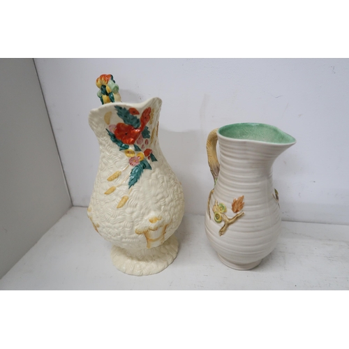 508 - A Clarice Cliff 'My Garden' Newport Pottery jug and a Celtic Harvest pitcher - both in good conditio... 