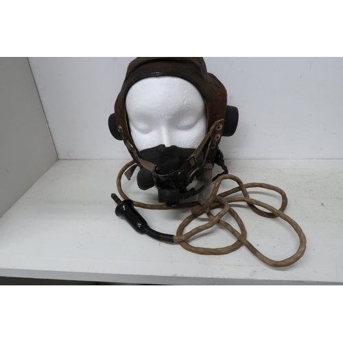 540 - A Lancaster flying helmet with its mask and intercom cable - in worn but reasonable condition - used... 