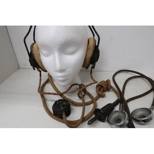 541 - A Lancaster flying helmet with headphones, intercom cable and goggles - in worn but reasonable condi... 