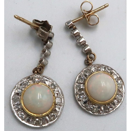 6 - A pair of diamond and opal drop earrings each designed as a single cut diamond line suspending a cir... 