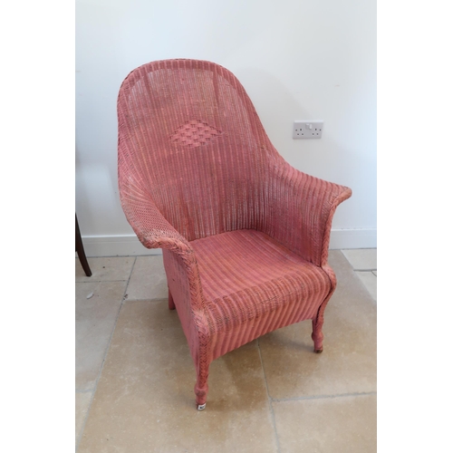 623 - A Lloyd Loom armchair - painted in pink, sound condition