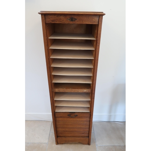 628 - A 1930's oak tambour fronted filing cabinet with an nice colour and good condition, with replaced sh... 