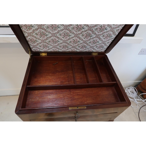 636 - A 19th century flame mahogany ladies sewing table with a rising top over drawers - in good condition... 