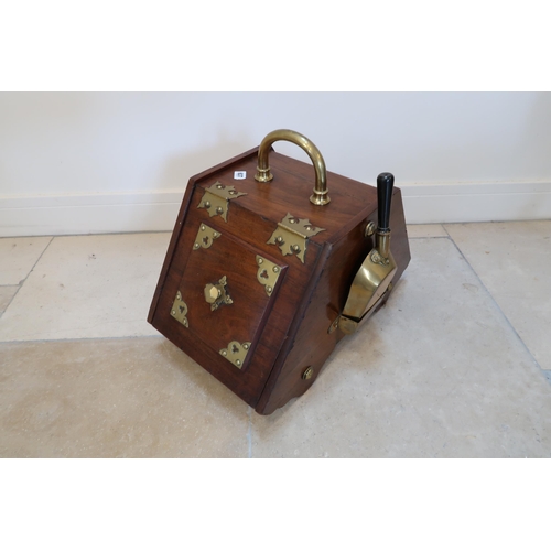 637 - An Edwardian mahogany and brass bound coal box with its shovel - in good condition