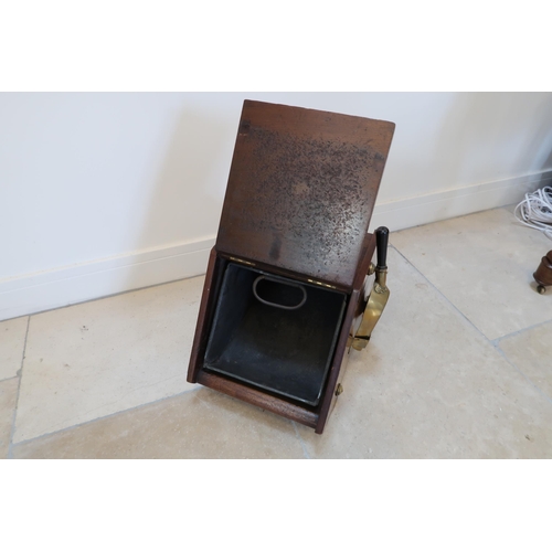 637 - An Edwardian mahogany and brass bound coal box with its shovel - in good condition