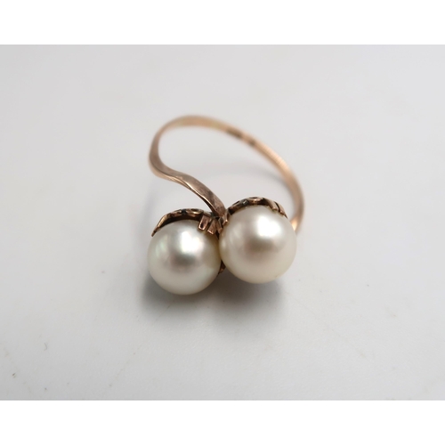 65 - A K10 marked two pearl dress ring - the pearls 7mm in diameter set to shoulder - ring size N/O - app... 