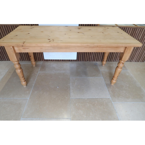 654 - A pine dining table raised on turned supports - Width 75.5cm x Length 167.5cm x Height 77cm - in goo... 