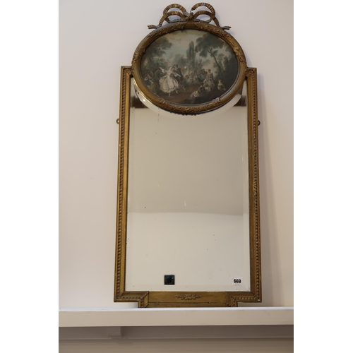 669 - A decorative mirror - 92cm x 40cm