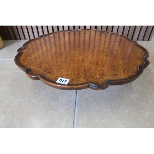 677 - A mahogany spinning table top Lazy Susan with pie crust boarder - Width 55cm x Height 10cm