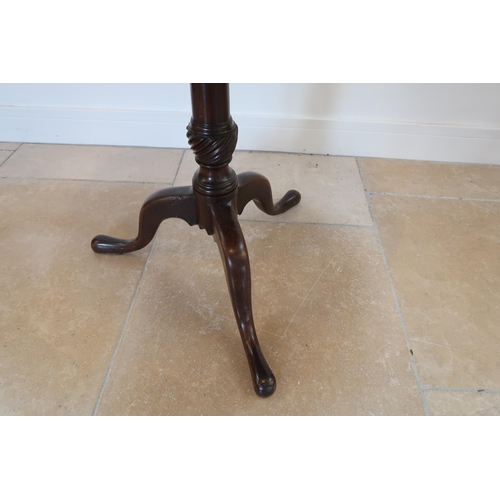 678 - A Georgian mahogany tripod table on a wrythern turned stem - Diameter 76cm