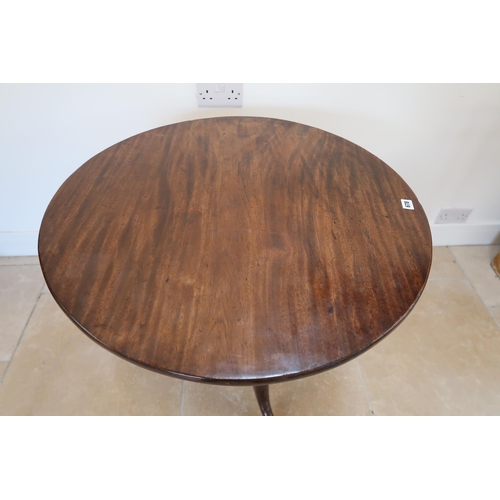 678 - A Georgian mahogany tripod table on a wrythern turned stem - Diameter 76cm