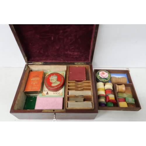 685 - A 19th century rosewood and inlaid games box with cards and games