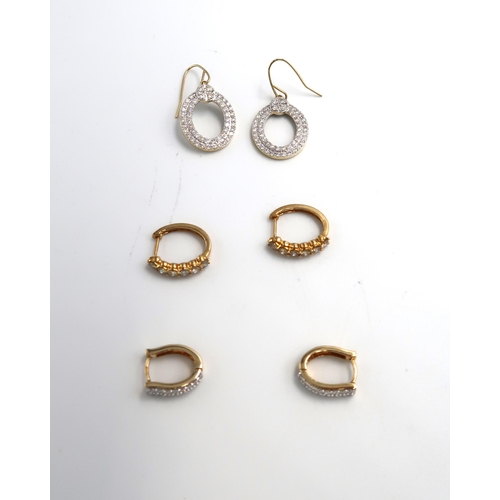 77 - Three pairs of 9ct gold earrings. A pair of brilliant cut diamond two row oval drop ear pendants. St... 