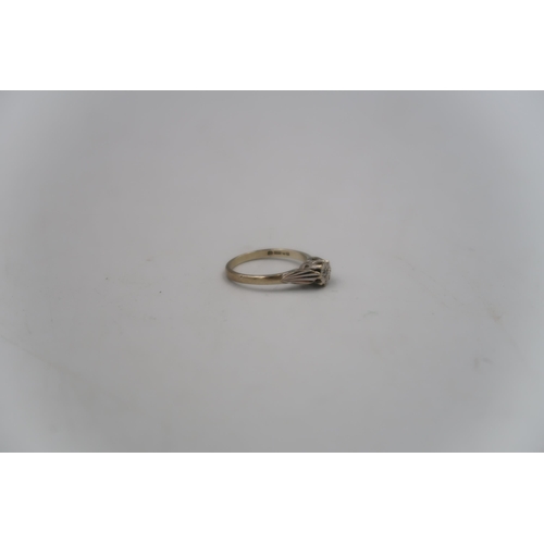 143 - A 9ct yellow gold hallmarked solitaire ring with small illusion set diamond in white gold - ring siz... 