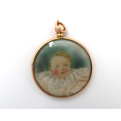 159 - A hallmarked 375 circular pendant with miniature watercolour of a child to centre - Diameter 3cm