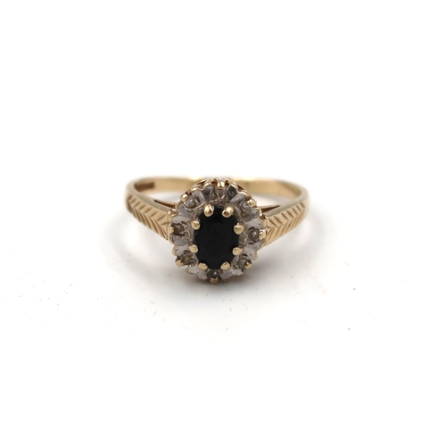 169 - A hallmarked 9ct yellow gold sapphire and diamond cluster ring size M - approx weight 1.8 grams