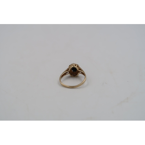 169 - A hallmarked 9ct yellow gold sapphire and diamond cluster ring size M - approx weight 1.8 grams