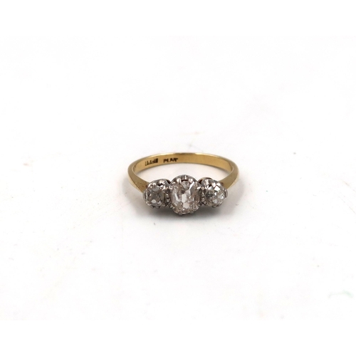 178 - An 18ct yellow gold and three stone diamond ring - the central stone approx 0.75ct - ring size M/N -... 