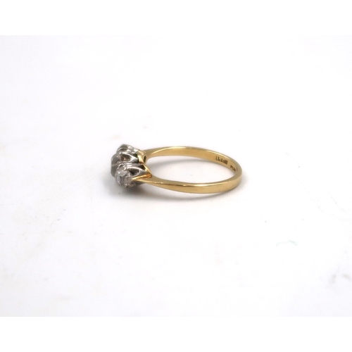 178 - An 18ct yellow gold and three stone diamond ring - the central stone approx 0.75ct - ring size M/N -... 