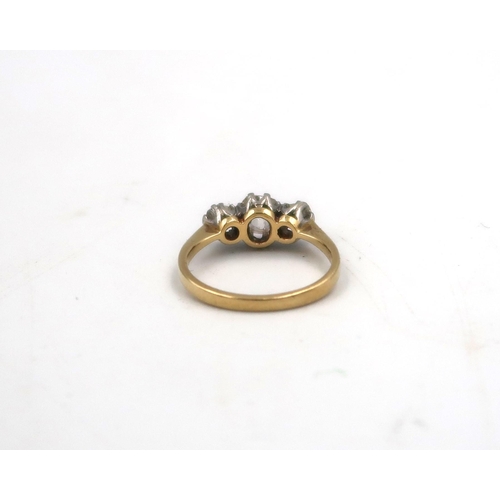 178 - An 18ct yellow gold and three stone diamond ring - the central stone approx 0.75ct - ring size M/N -... 