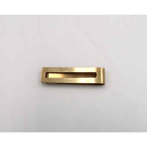 201 - A 9ct gold hallmarked yellow gold money clip - approx weight 8.5 grams - clean and bright