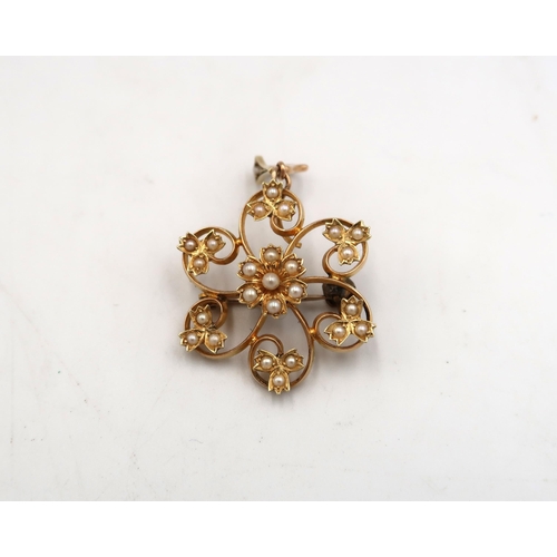 204 - A marked 15ct yellow gold pendant set with seed pearls with suspension loop of floral design - Diame... 