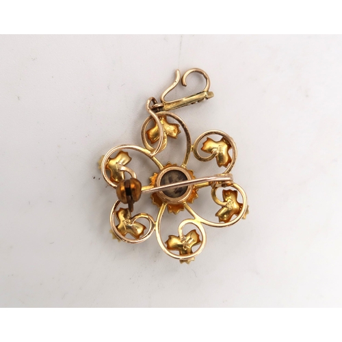 204 - A marked 15ct yellow gold pendant set with seed pearls with suspension loop of floral design - Diame... 