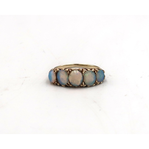 206 - A tested 9ct yellow gold and five oval opal ring size K - approx weight 3.3 grams - clean and bright