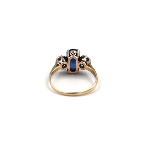 214 - An oval sapphire and old cut diamond three stone ring. Estimated total diamond weight 0.60ct. Stampe... 