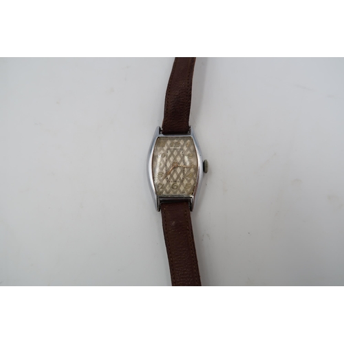 283 - An unmarked ladies chrome cased wristwatch with Arabic numerals to silvered dial on leather strap - ... 