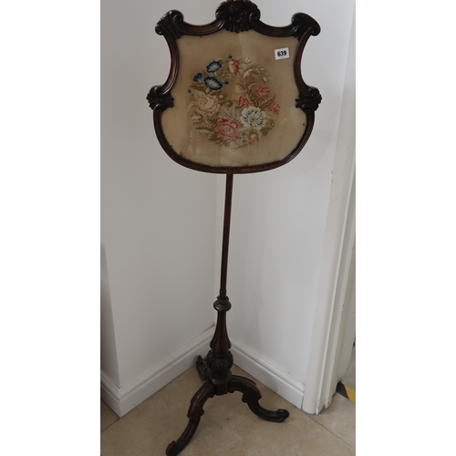 639 - A 19th century pole screen with a needle print top