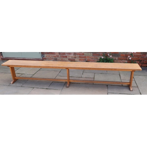 652 - An oak hall bench removed from The Leys School dining hall in Cambridge - Width 280cm x Height 47cm