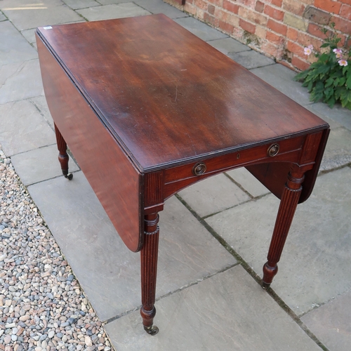 690 - An early 19th century Cuban mahogany drop flap dining table with two dummy drawers on slender reeded... 