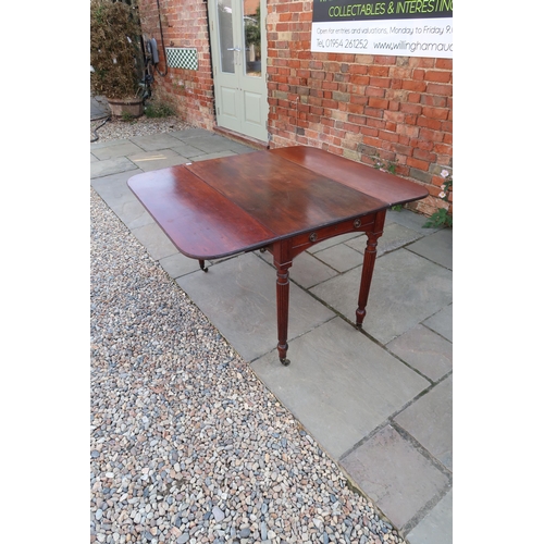 690 - An early 19th century Cuban mahogany drop flap dining table with two dummy drawers on slender reeded... 