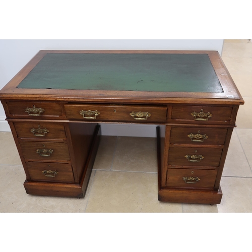 697 - A Victorian aesthetic movement twin pedestal desk of nine drawers - 122cm x 68cm x Height 72cm