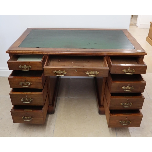 697 - A Victorian aesthetic movement twin pedestal desk of nine drawers - 122cm x 68cm x Height 72cm